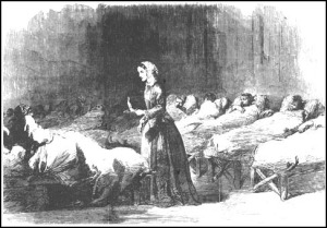 Engraving of Florence Nightingale with a lamp in a hospital ward.